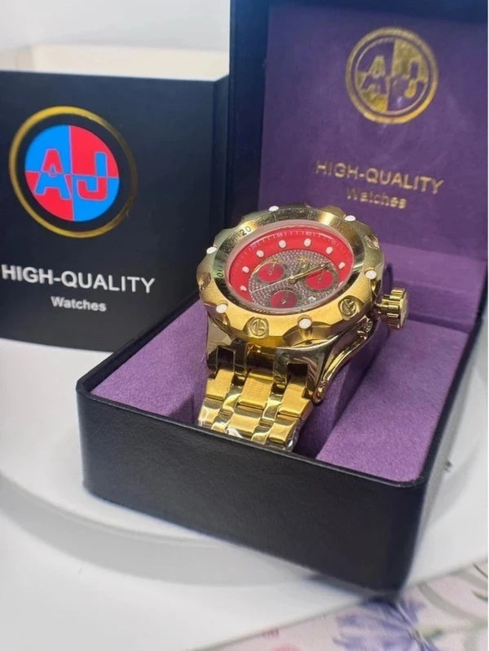 AJ stainless steel heavy-tank watch gold tone, red face bling